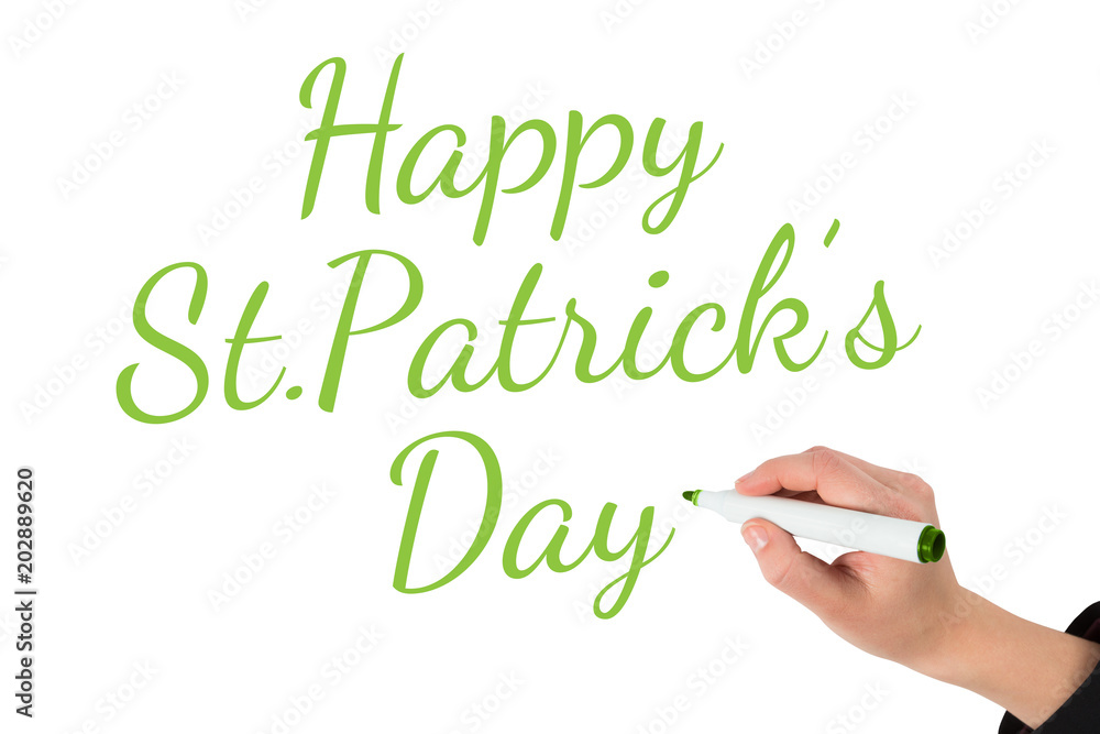 Businesswomans hand writing with marker against happy st patricks day Businesswomans hand writing with marker against happy st patricks day