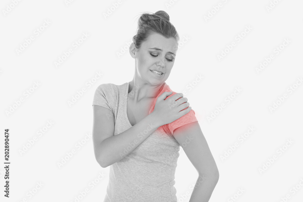 Young woman suffering from shoulder pain against white background Young woman suffering from shoulder pain against white background