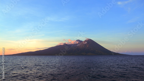 Volcanic Mountain island sunset in Sumbawa Indonesia photo