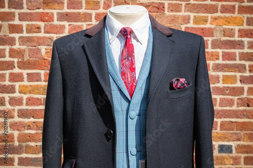 Traditional English three-piece suit on display at Camden market in London photo