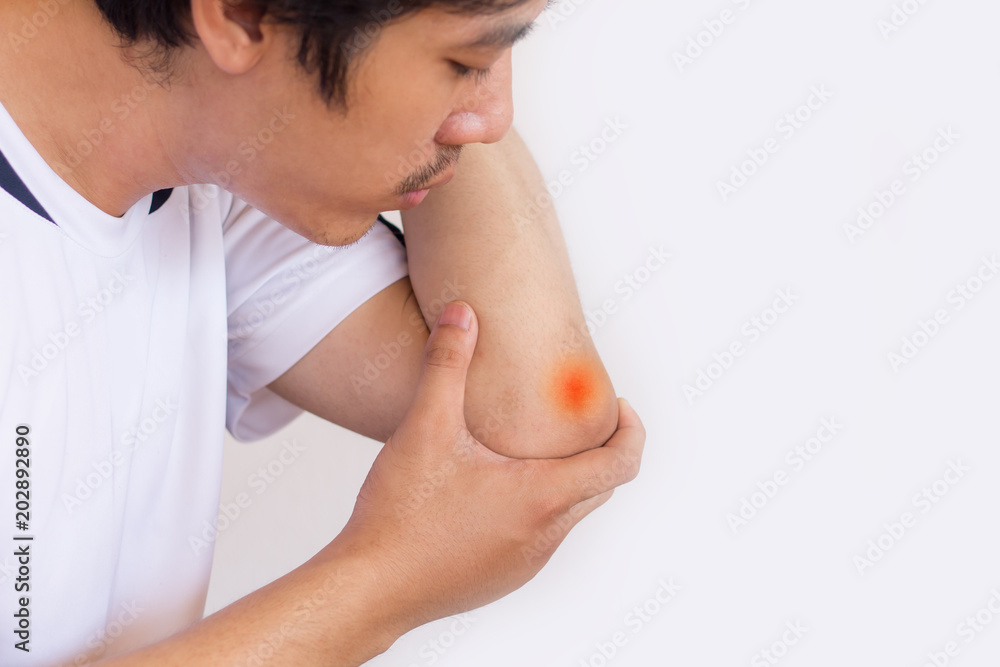 Obraz premium Man suffering from elbow pain and feeling bad on white background,Health care concept