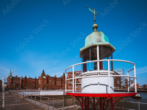 Old beacon or small lighthouse in Hamburg Hafencity photo