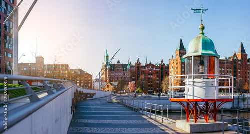 Panorama of Hafencity with old beacon lighthouse and red brick building in background, Speicherstadt in Hamburg