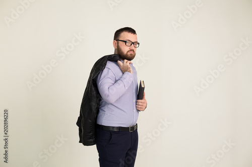 Portrait of a man in business attire with a book photo