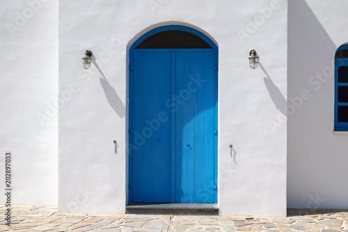 Facade of building with blue doors.