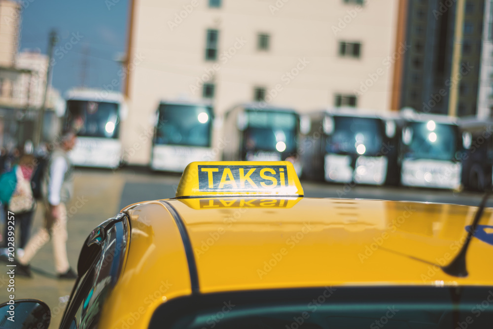 Fototapeta premium Taksi with tour bus background in istanbul
