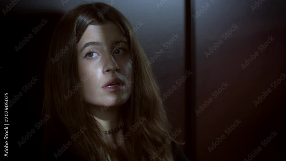 Pensive Sad Young Woman Looking The Camera On Black Background Pensive Sad Young Woman Looking The Camera On Black Background