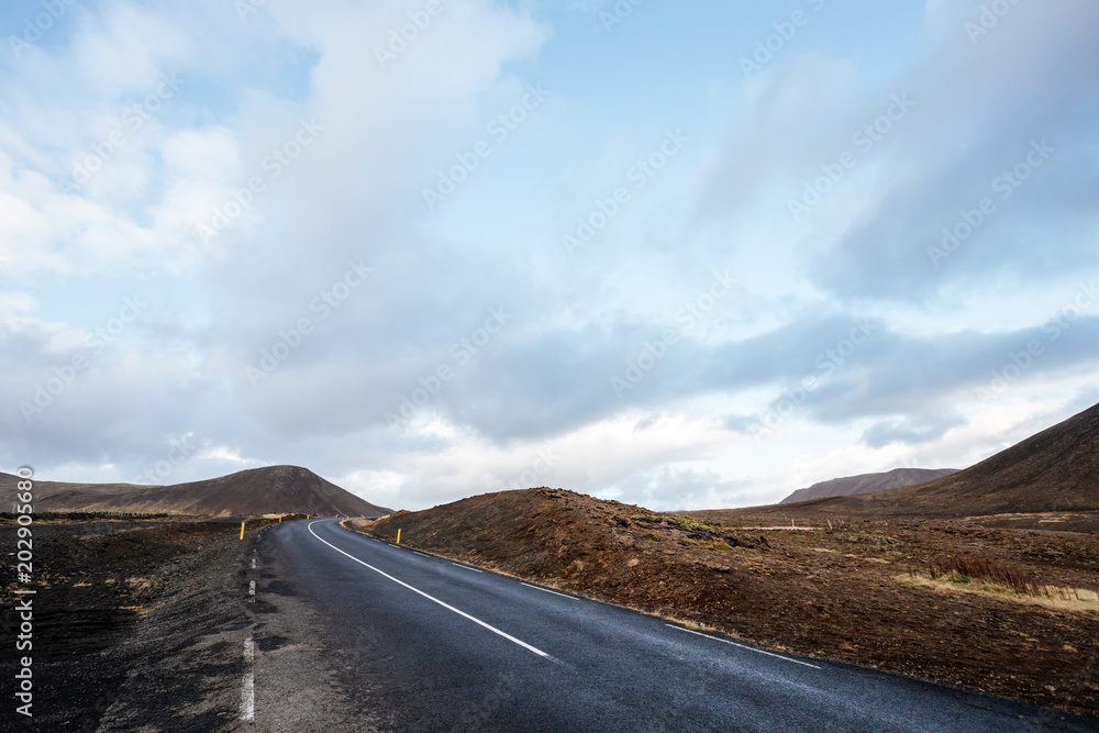 Road between fields on Atlantic South Coast in Iceland Road between fields on Atlantic South Coast in Iceland