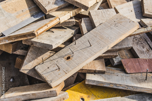 Chaotic pile of wooden boards.