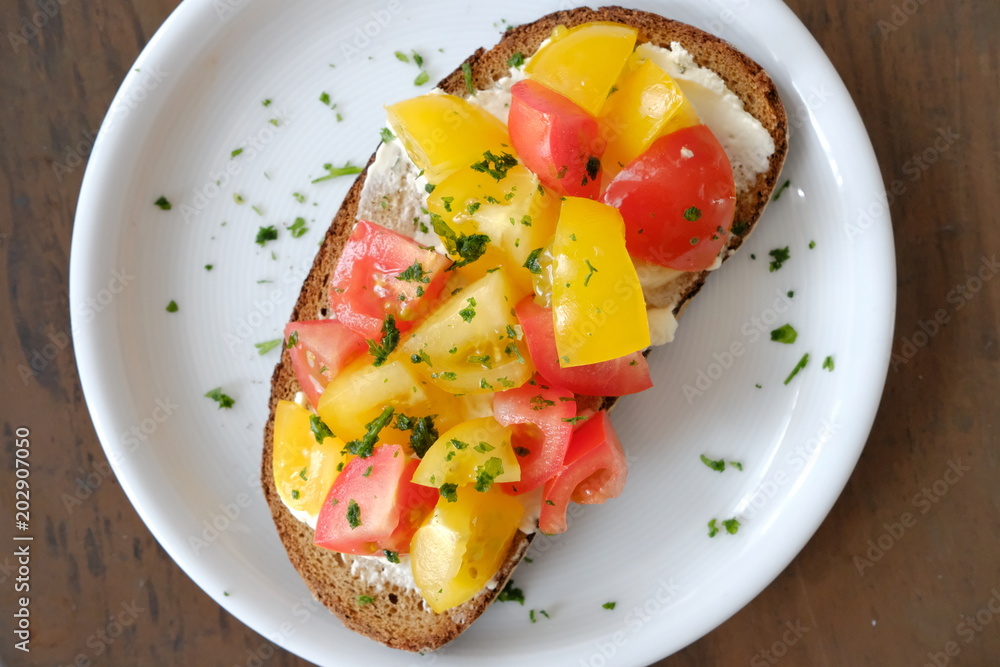 close-up of bread with fresh tomatoes served on plate close-up of bread with fresh tomatoes served on plate