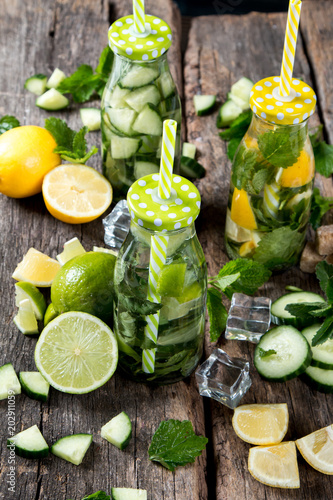 Mohito drinks on wooden with blur beach background. Fresh drinks with fruits on wood. Summer concept.