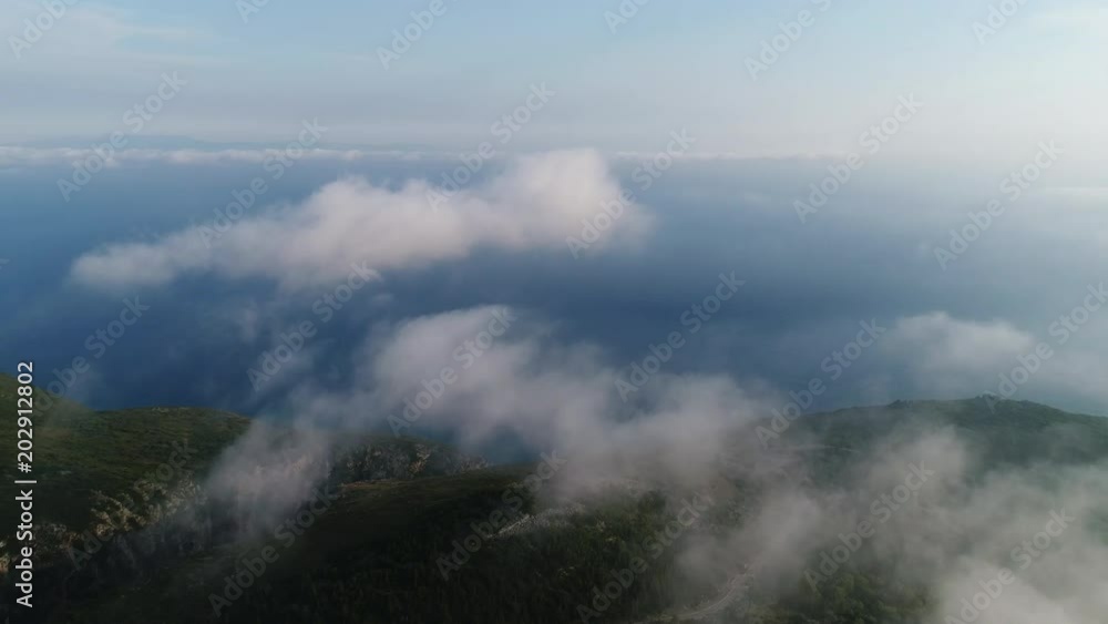 4K Aerial view. Flying over the beautiful mountain seaside in clouds 4K Aerial view. Flying over the beautiful mountain seaside in clouds