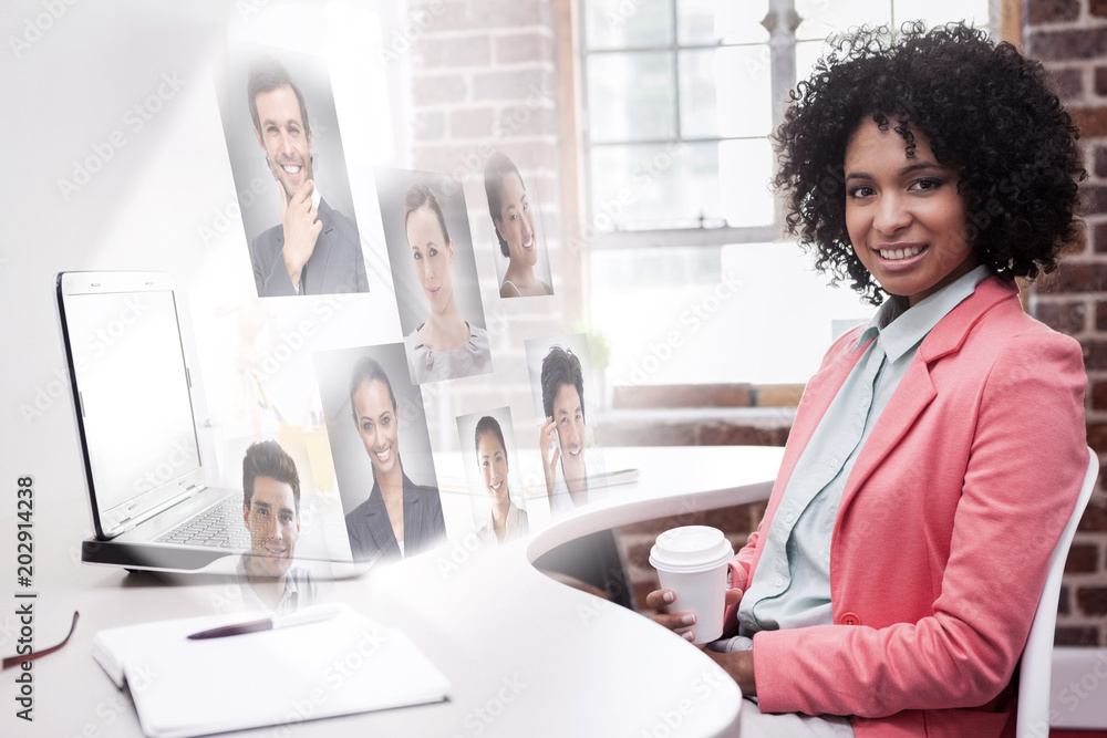 Φωτογραφία Happy casual businesswoman sitting at desk against profile pictures