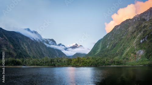 Beautiful sunset color at Harrison Cove in Milford Sound  Fiordland National Park  New Zealand  South Island