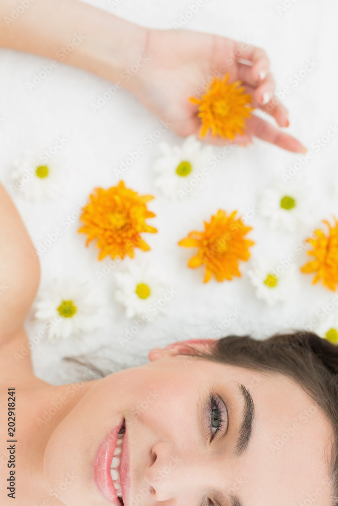 Beautiful young woman with flowers in beauty salon Beautiful young woman with flowers in beauty salon