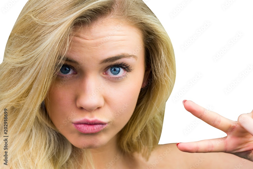 Natural blonde beauty making peace sign Natural blonde beauty making peace sign