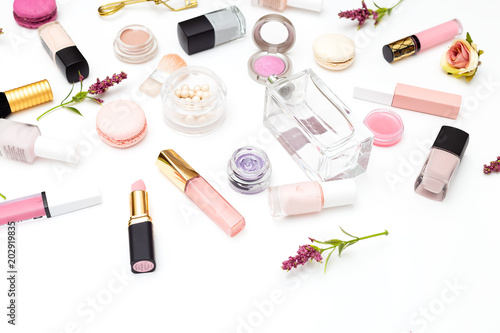 Make up products and flowers on white background. Beauty