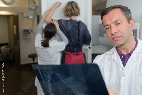 doctor holding x-ray picture of pancreas