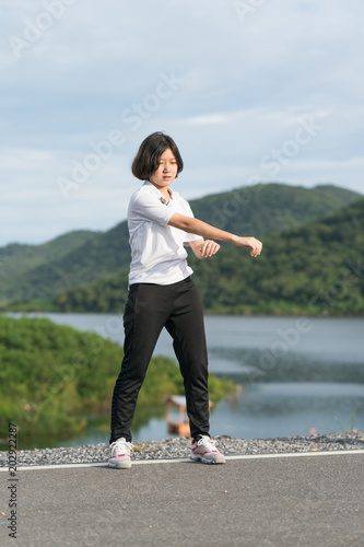 Woman short hair doing exercising outdoor