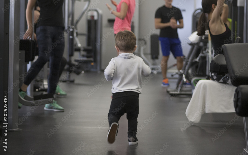 little boy in a sport suit running in the gym little boy in a sport suit running in the gym