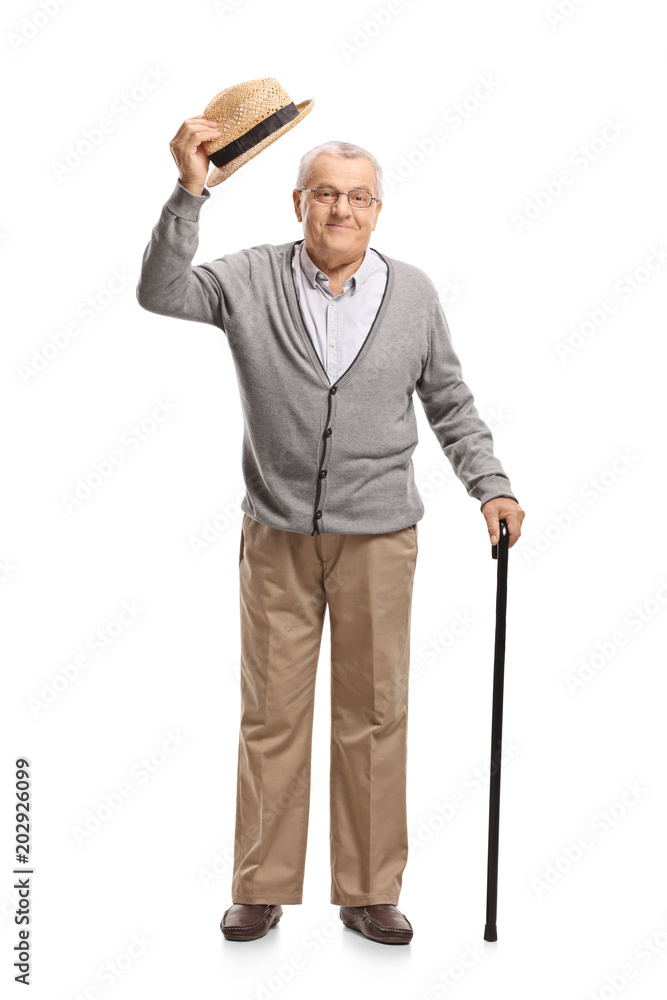 Mature man raising his hat as a greeting Mature man raising his hat as a greeting