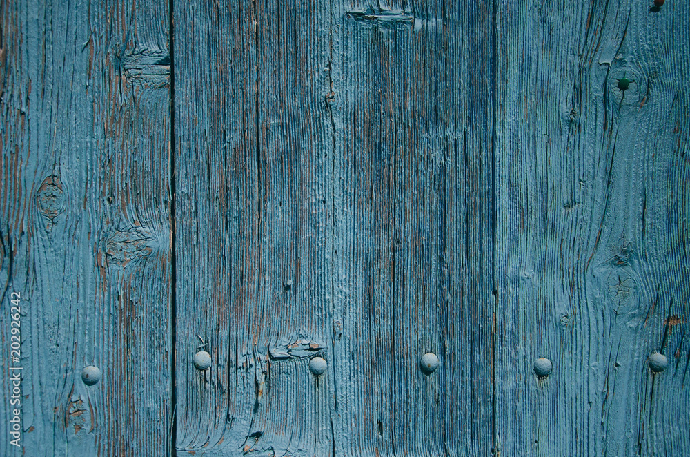 Old blue wooden texture with hobnail, pin. Wooden material surface background. Vintage grunge wood. Copyplace, place for text Old blue wooden texture with hobnail, pin. Wooden material surface background. Vintage grunge wood. Copyplace, place for text