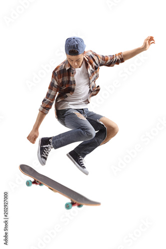 Teenage skater boy jumping