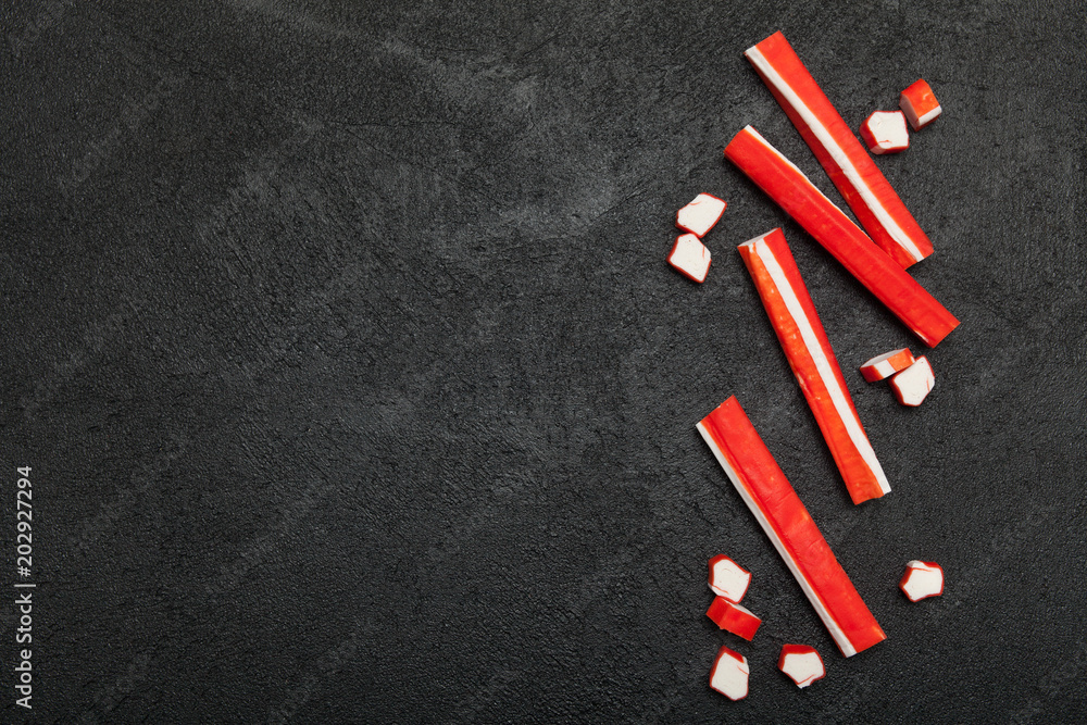 Asian snack surimi, artificial substitute for crab meat. Copy space for text. Asian snack surimi, artificial substitute for crab meat. Copy space for text.
