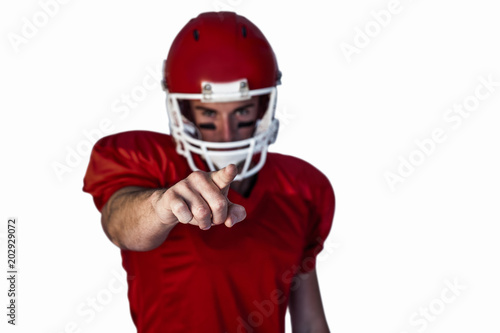 Rugby player pointing over white background