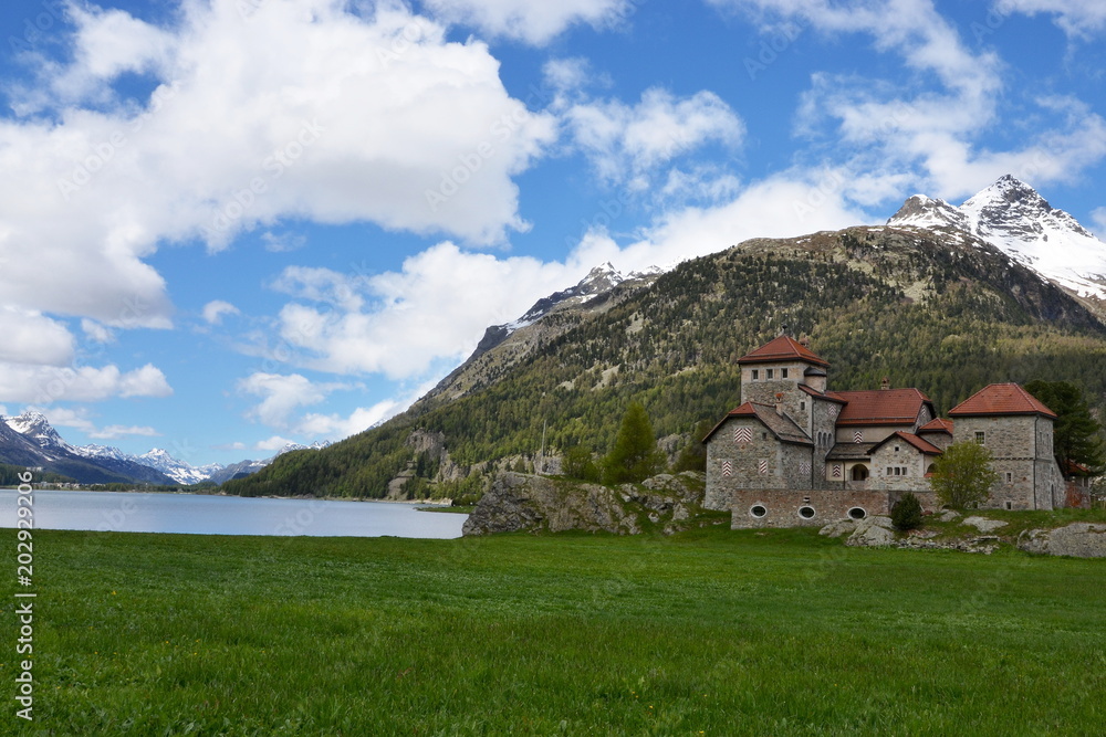 Swiss Alps-view on the castle of Surlej and lake Silvaplana
