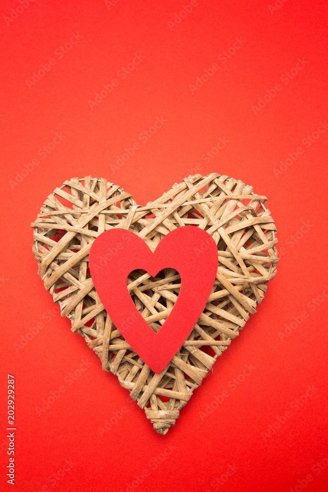 Wicker heart ornament with red cut out Wicker heart ornament with red cut out