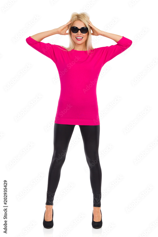 Fototapeta premium Beautiful Woman Is Holding Head In Hands And Smiling