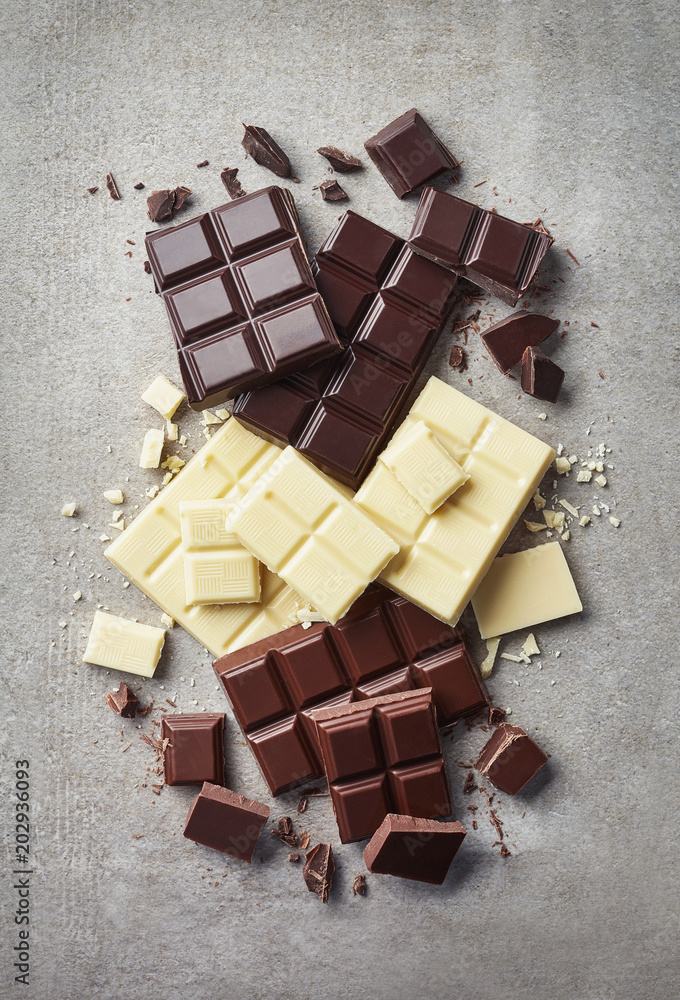 Fotografie Dark, white and milk chocolate pieces