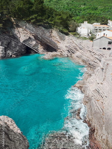 Cliff in Petrovac, Montenegro. Turquoise water adriatic sea. Beautiful mediterranean landscape.