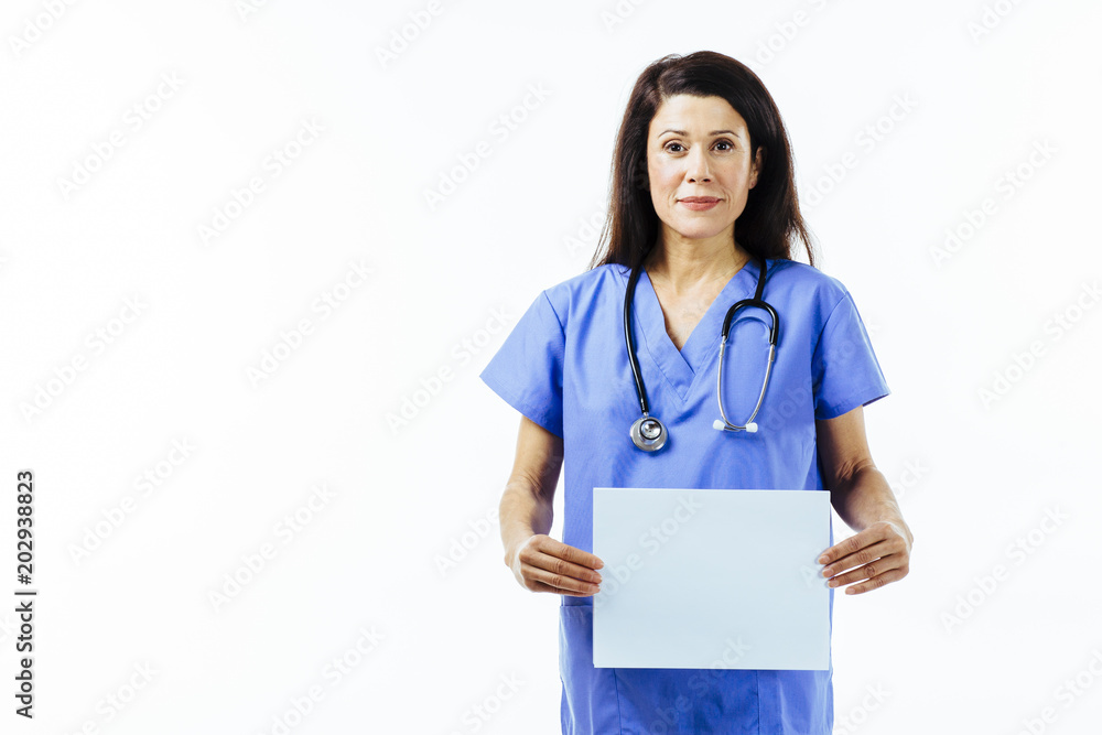 Portrait of a female nurse or doctor in blue uniform holding a blank sign isolated on white studio background Portrait of a female nurse or doctor in blue uniform holding a blank sign isolated on white studio background