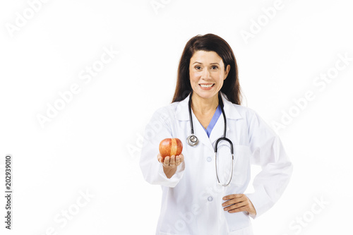 Portrait of a smiling female doctor isolated on white studio background