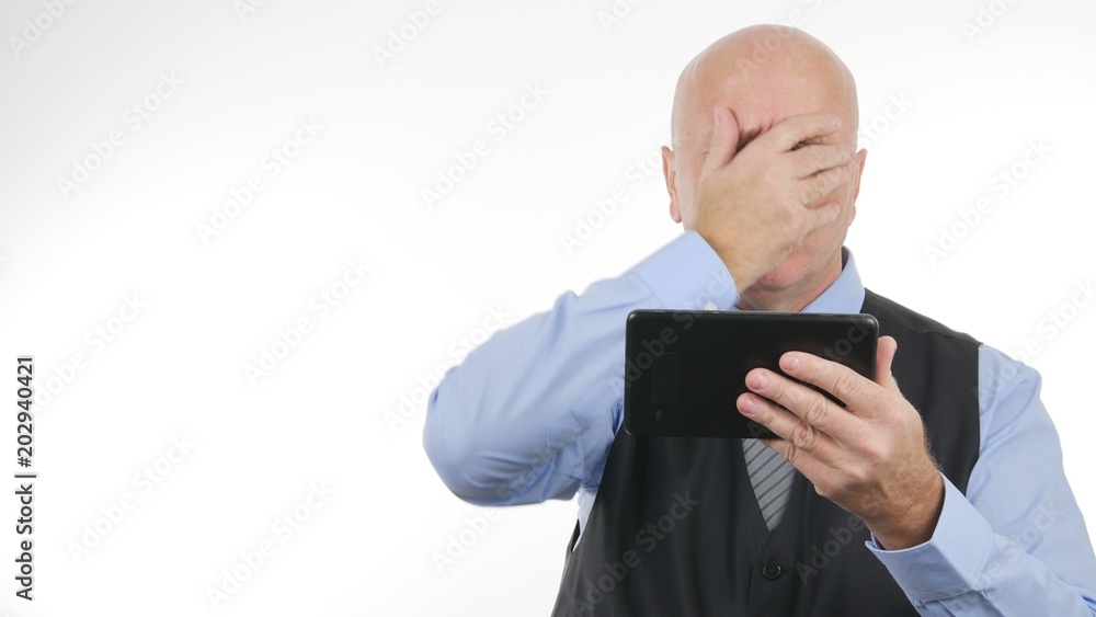 Troubled Businessman Read Bad Financial News on Tablet Make Nervous Gestures Troubled Businessman Read Bad Financial News on Tablet Make Nervous Gestures