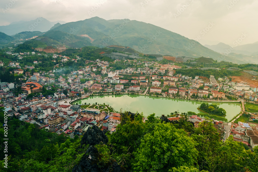 Aerial view of landmark landscape at the hill town in Sapa city with the sunny light, Vietnam Aerial view of landmark landscape at the hill town in Sapa city with the sunny light, Vietnam