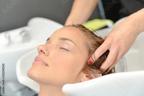 Lady having hair washed in salon