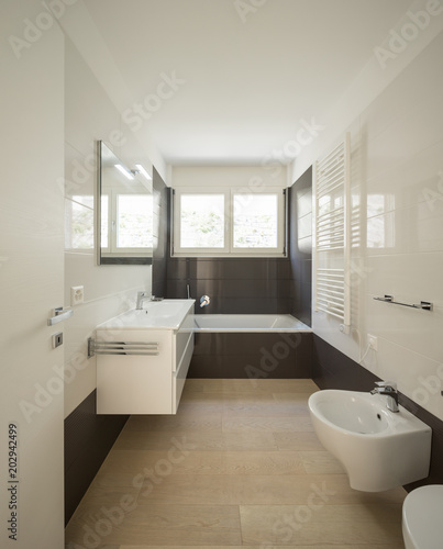 Modern bathroom with large dark tiles