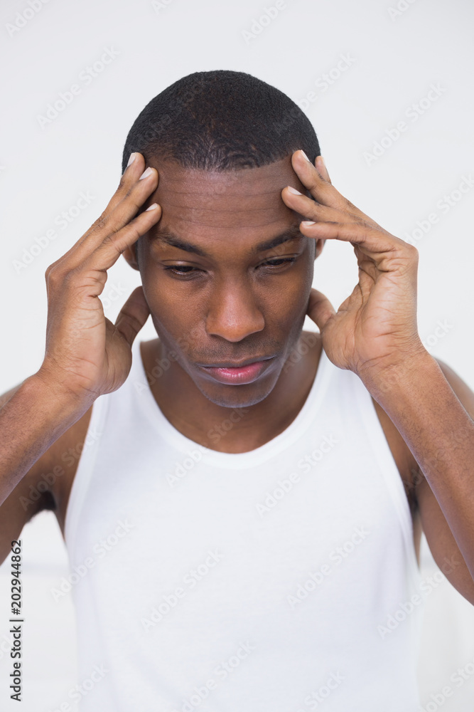 Close up of a young Afro man suffering from headache Close up of a young Afro man suffering from headache