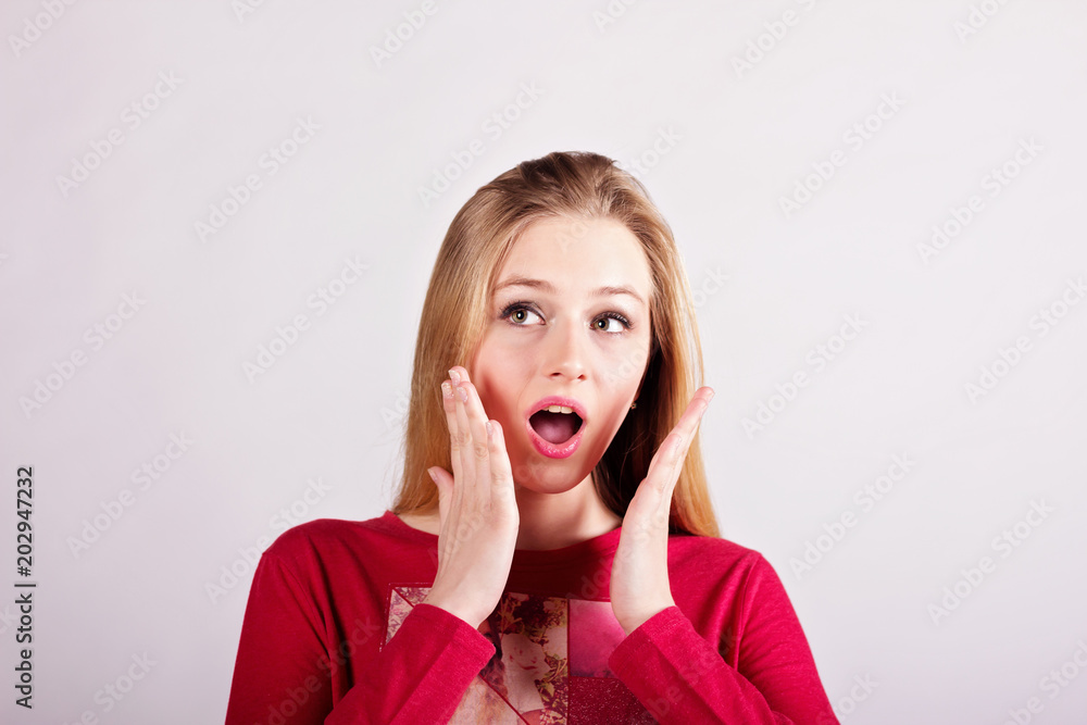 Very surprised beautiful blonde girl isolated on a white background. Very surprised beautiful blonde girl isolated on a white background.