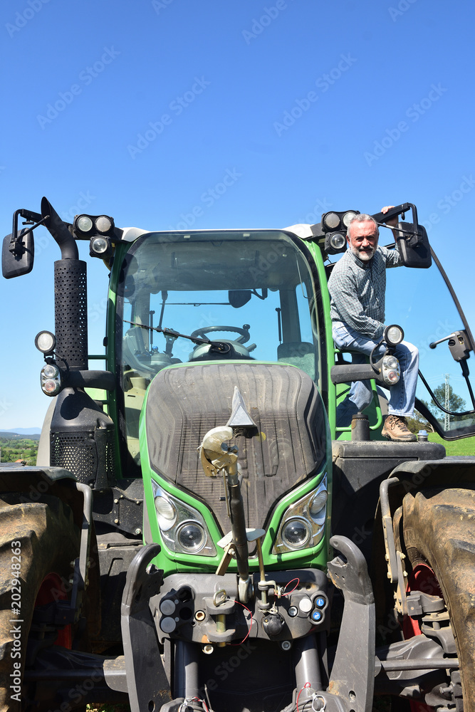 portrait of a farmer man and tractor