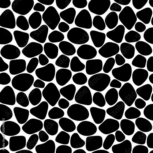 Seamless pattern of black stones on white