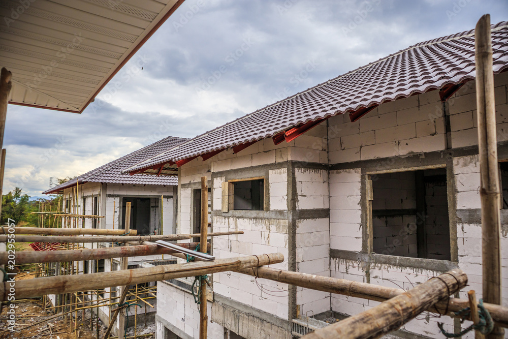 construction residential new house in progress at building site construction residential new house in progress at building site