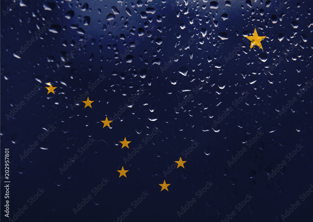 Texture of Alaska flag on the glass with drops of rain. Texture of Alaska flag on the glass with drops of rain.