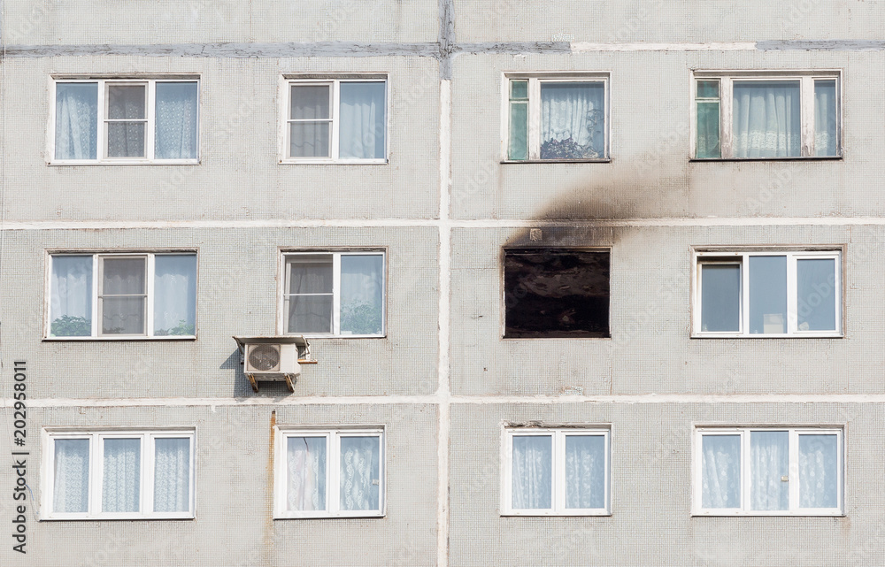 The window burned apartment in a high-rise building.