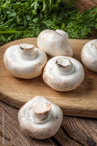 Fresh mushrooms on cutting board.