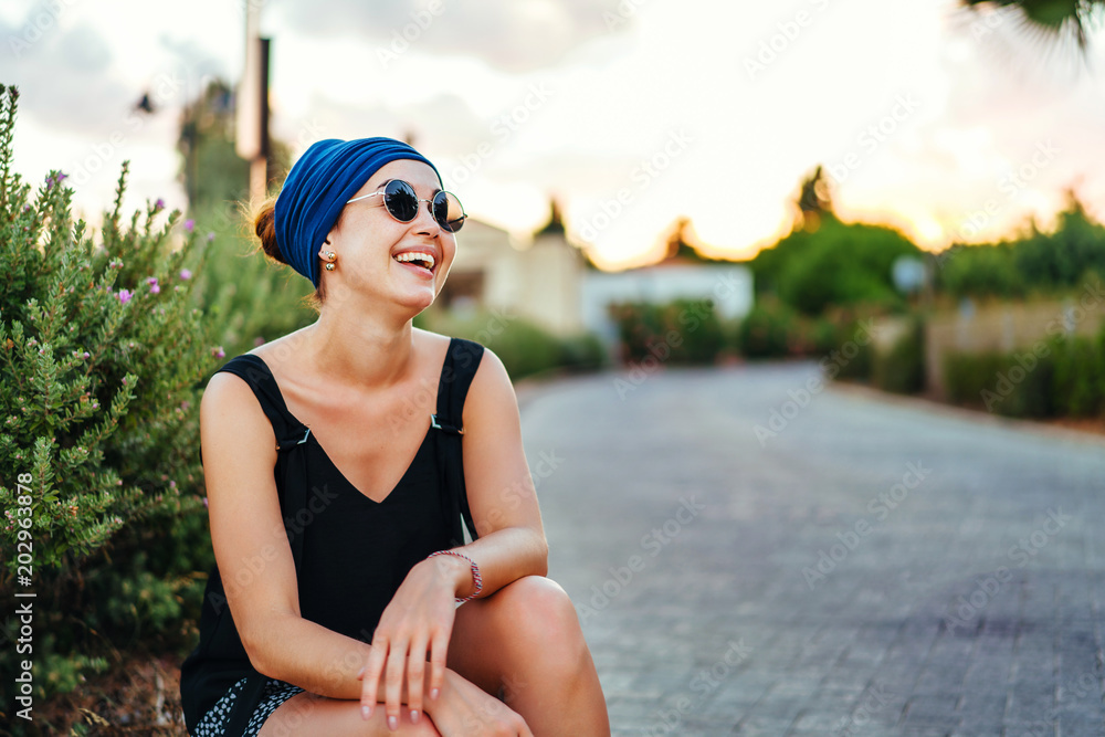 brunette tourist girl relaxing on the street brunette tourist girl relaxing on the street