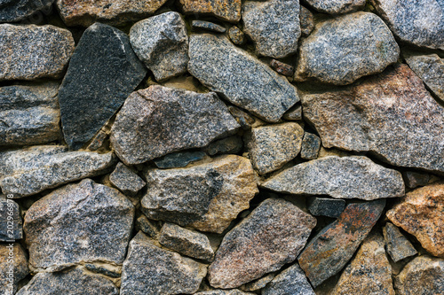 Gray stone wall. Large natural stones, texture, background.